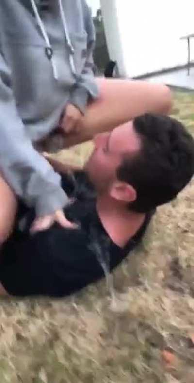 Blasting his face with piss in the yard