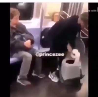 the man in the red shirt sits there unfazed