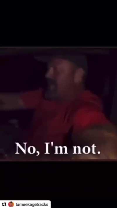 Cop flags a drunk driver. 