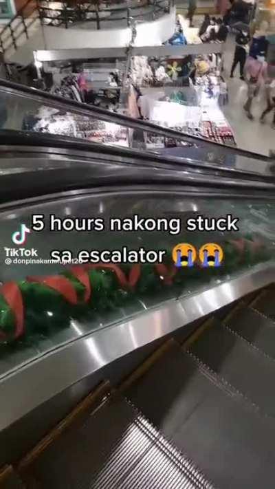He got trapped by an stuck escalator