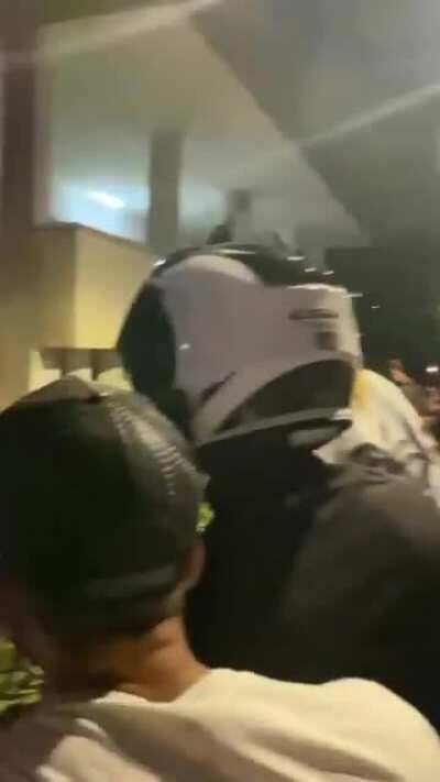 Dozens gather at a dog beater home after his address was published on Facebook