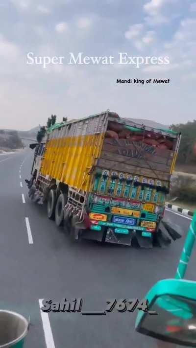 Overloaded truck in india .