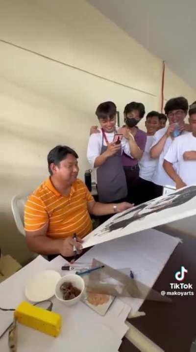 Art teacher grades his students drawing