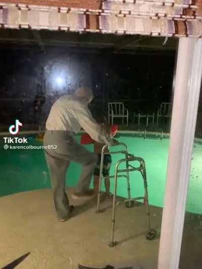 Grandpa kicks his great-great grandson into the pool