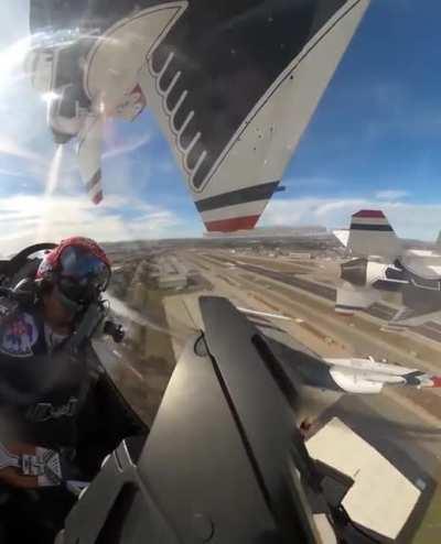 US Air Force Thunderbirds performing their 'Diamond Pass in Review'. During this maneuver, the jets can be as close as 18” apart while traveling at almost 400 MPH (643 KPH).
