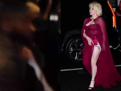 Billie's leg in a red dress