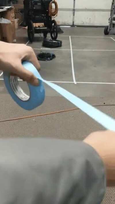 Pulling tape over to the side so you don’t have to waste time peeling it off on the next use.
