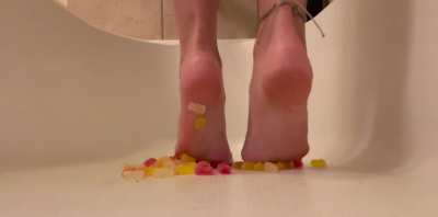 Squishing gummy bears with my dirty feet 