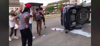 Salt Lake City rioters overturn a police car