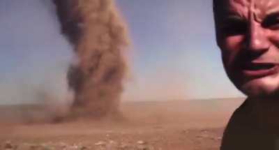 “Here It Comes” dude standing in front of Tornado.