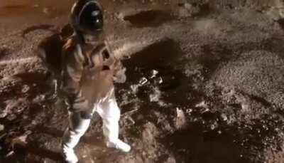 A man in India protesting for better roads