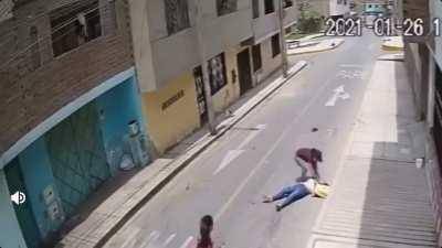 Trying to stop a vehicle by moving in front of it.