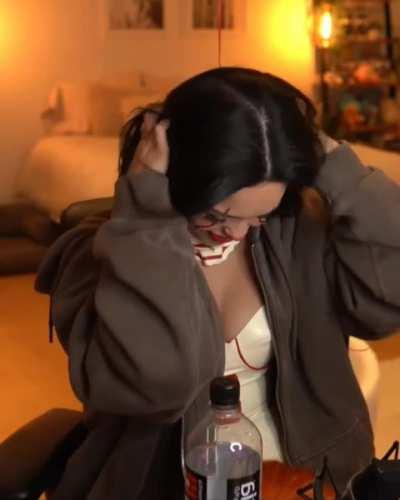 Rae taking the wig off