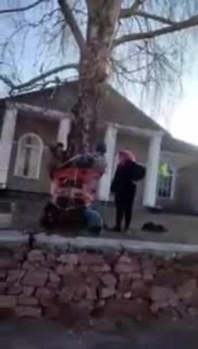 man and woman caught looting a fallen Ukrainian soldiers home