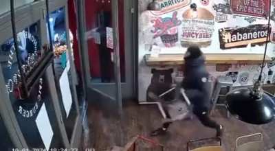  A wild machete fight breaks out in a shop in the UK.