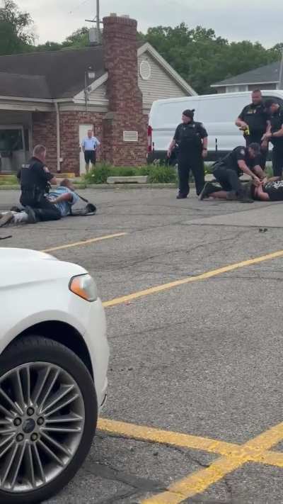 Grand Rapids PD violently arrest a canvasser and observer after kicking bystander in the groin.