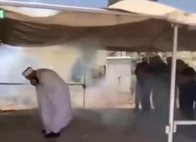 Israeli “soldiers”(clowns) shooting teargas at people praying