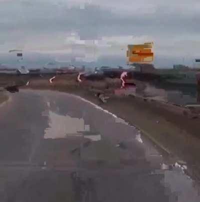 Guy crashes bike and falls off bridge, but the bike still had places to go