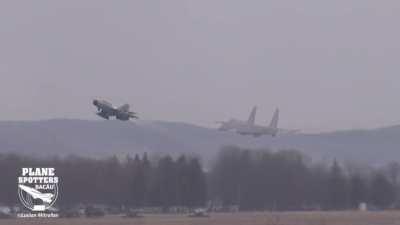 Ukrainian Su-27 does a wing wave as it takes off to return from Romania. The plane was escorted back by two Romanian Mig-21s