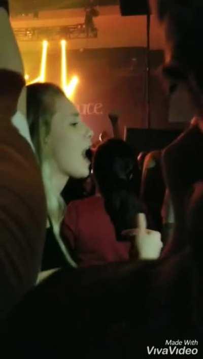 Daughter signing for her father at a rock concert