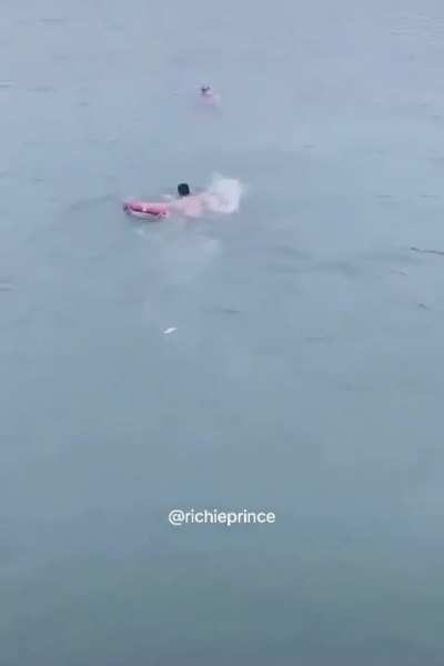 Man strips his clothes and jumps into freezing cold water to save a random person.
