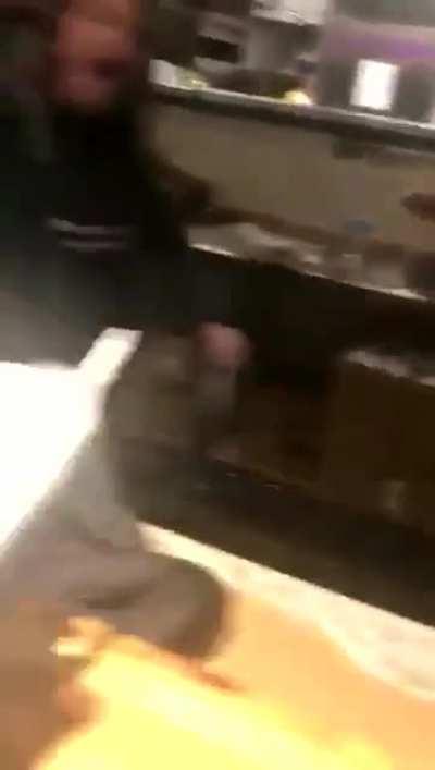 Cashier pops her tit out as a power move while berating a customer