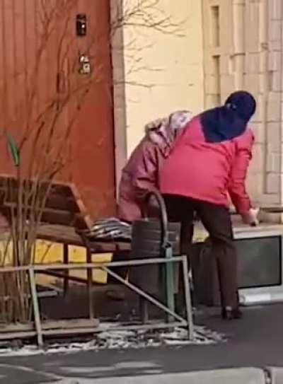 TV getting a beat down by two babushkas