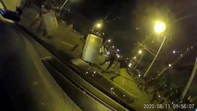 A group of russians driving thro Minsk riots with a russian number plate, the riot police went mental on them