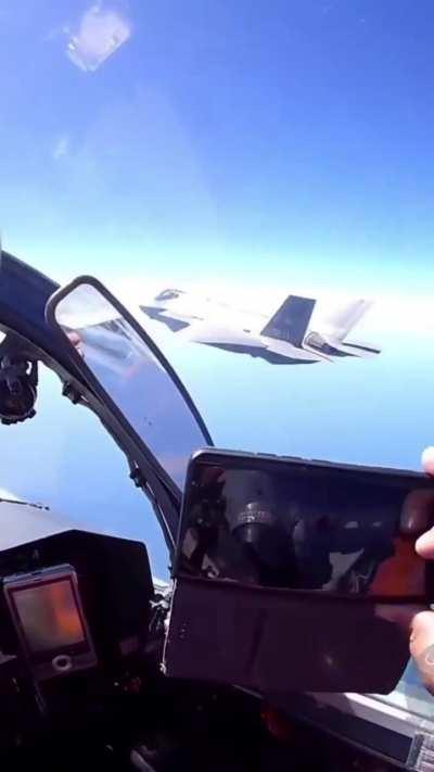 BREAKING video...A Su-27 intercepts an F-35 somewhere over the Baltic Sea.