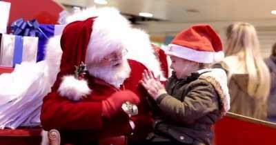 a mall santa signing for a deaf child