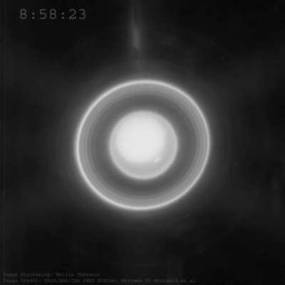 Animation showing the moons (blurred smudges) orbiting the planet Uranus and showing the rotation (movement of a spot). Other elongated object moving from top to bottom are background stars. Processed by Melina Thévenot
