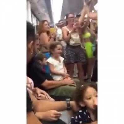 Bunch of drunk guys sing baby shark to a little girl in the subway during Carnival in Rio (before covid)