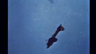 A B-17 going down during a bombing mission. The crew talking is the 