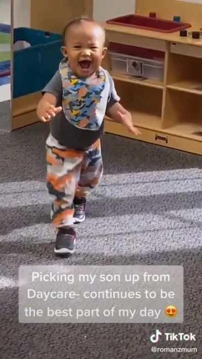 The reaction of her son when she comes to pick him up