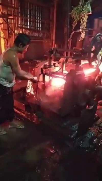 Worker has water thrown on him to deal with heat