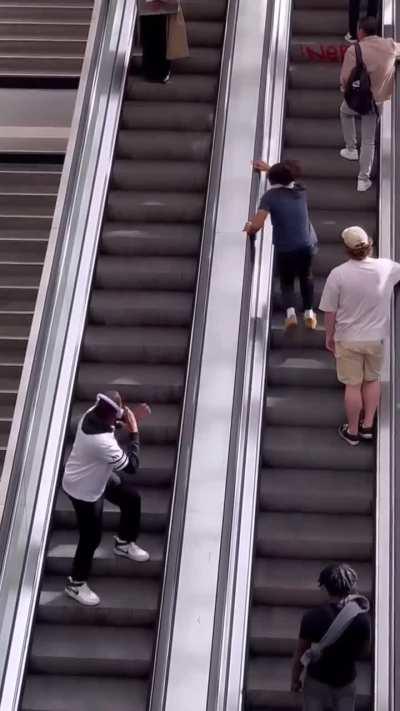 Want to be as unbothered as black shirt guy