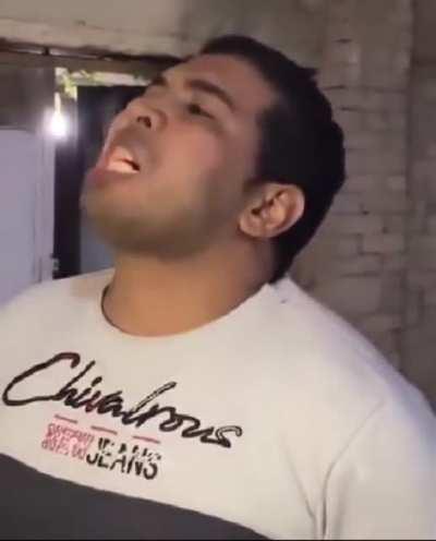 Guy eats burning coal