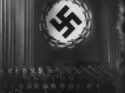 Theater full of german citizens singing the party theme after a speech. Crazy what brainwashing does to people.