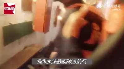 Chinese coastguardsmen board a drug trafficking ship, March 15, 2024; news video from Changsha Broadcasting TV on weibo