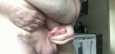 Big guy with a little guy,  was house-sitting for a friend for a few days when they went on vacay. Came hard and fast standing in their kitchen with the window curtains wide open and the neighbours roaming about outside.