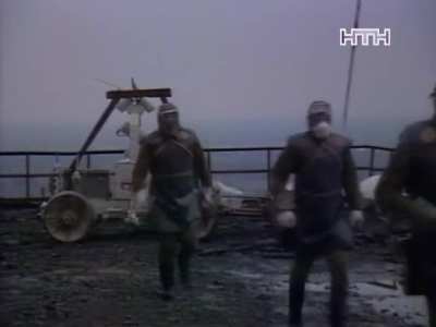 Well-known footage of biorobots and STR-1. The clanging of metal in the background implies their shift was over.