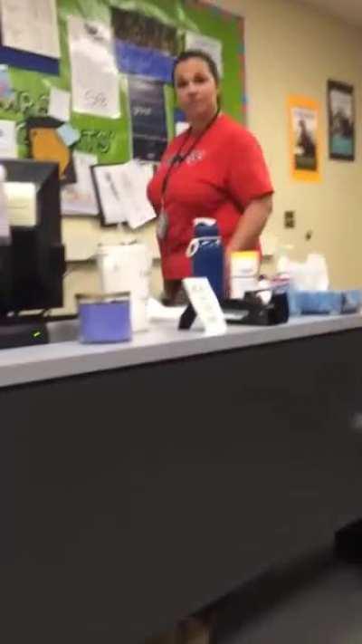 Student hides under desk and grabs teacher's ankle