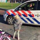 Dutch police racing a little girl on a bicycle