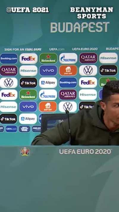 Ronaldo removing Euro 2020 sponsor Coca-Cola bottles in front of him before his press conference, adding 'Drink water!' instead