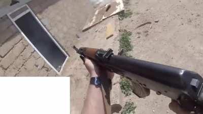Former SEAL cleansing a safehouse of ISIS fighters with an AK (there is a watermark below the white rectangle, I covered it so it doesn't look like an ad)