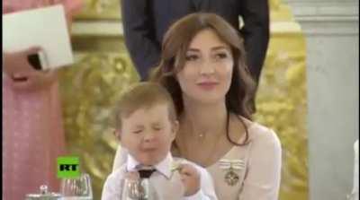 Kid tasting a lime at a ceremony