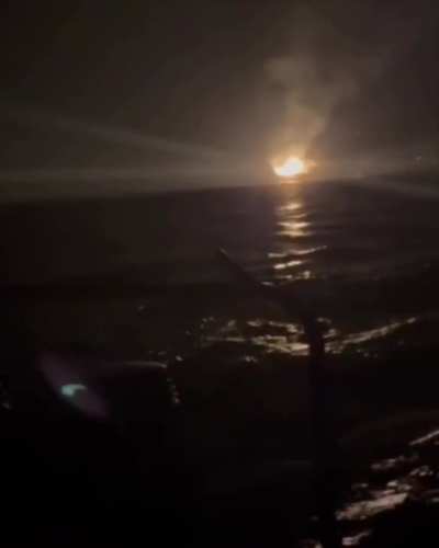 The burning Black Sea Crimea-2 platform as seen by an HUR member in an assault boat. The raid took place on the night of September 11, 2024.