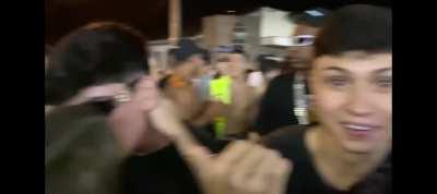 Brazilian guys tongue kissing at Carnival party