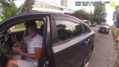 Cop tries to pull random person out of their vehicle and then fires at them as they drive away