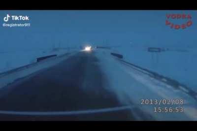 an idiot in Russia decides it would be a great idea to overtake a truck on a slippery road